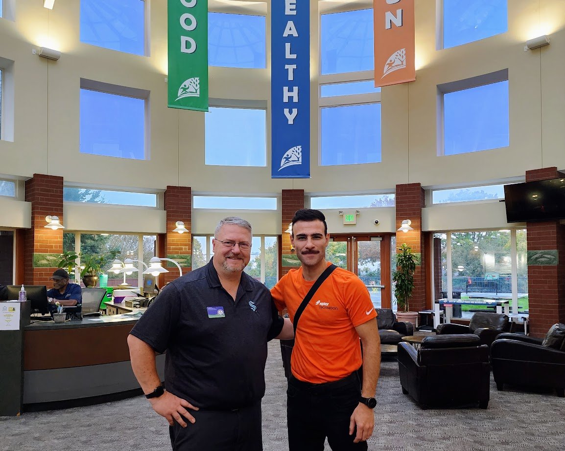 John Dunn III Recreation Superintendent at City of Tukwila with an Xplor Recreation staff member at Tukwila community center